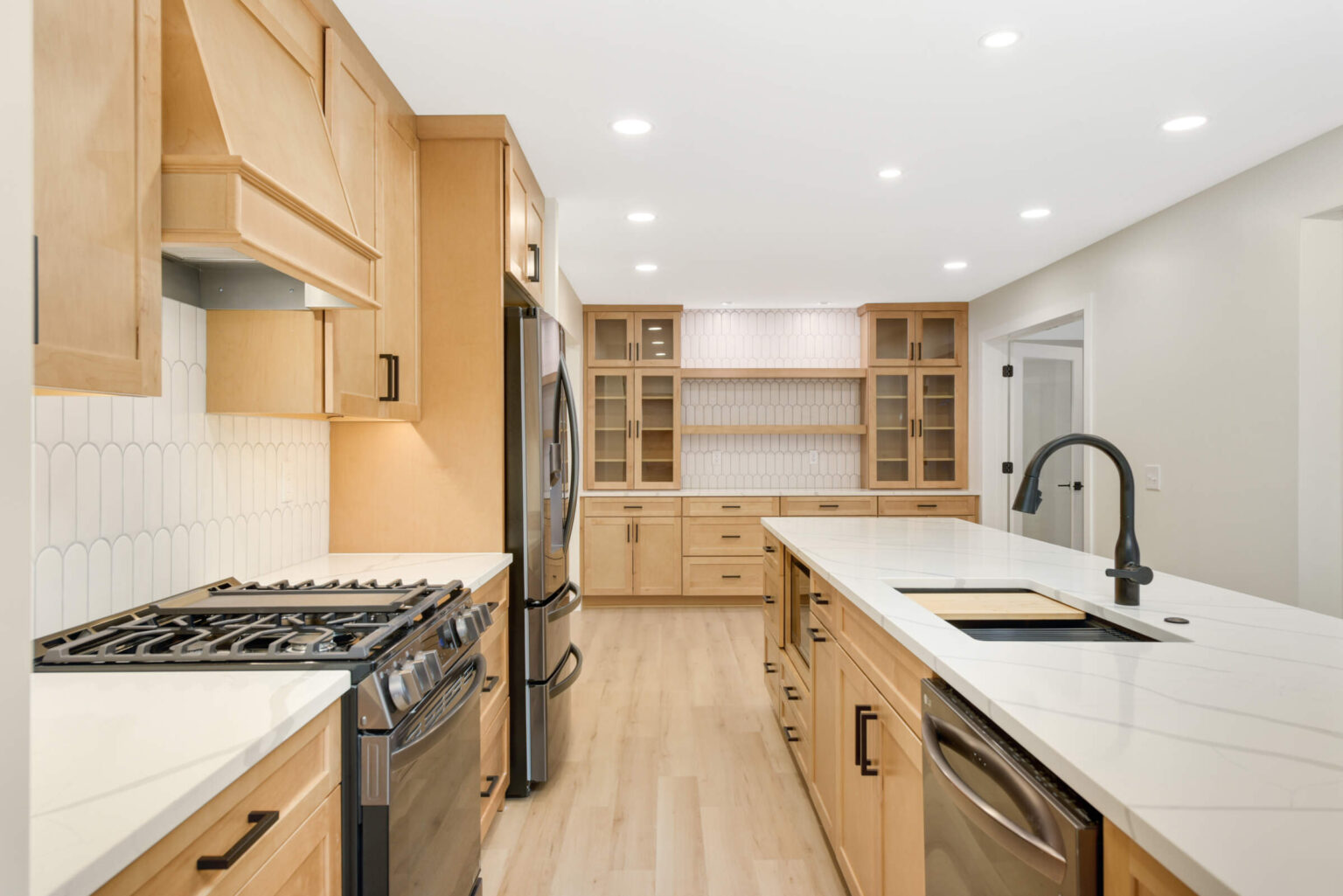 Kitchen remodel with gas range and custom cabinets